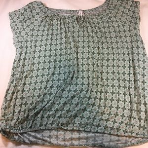 Cap sleeved top with geometric teal pattern